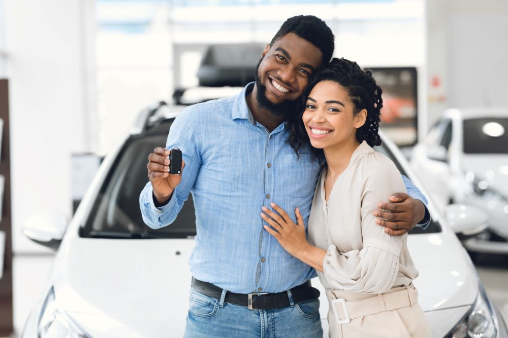 Couple holding car keys