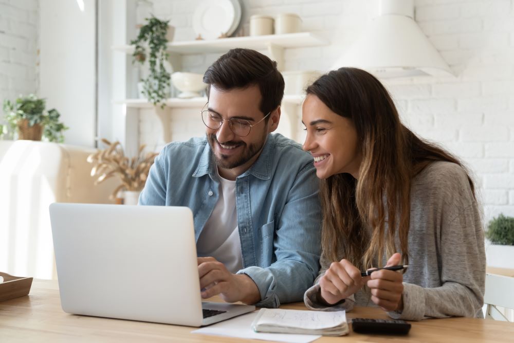 couple using laptop computer