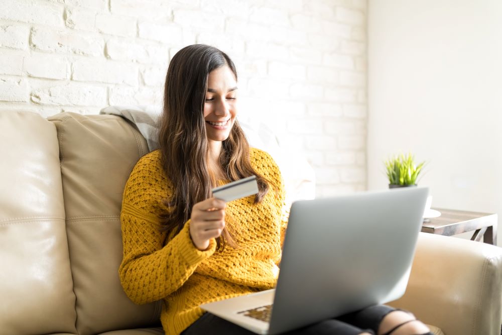 Woman Using Laptop And Credit Card