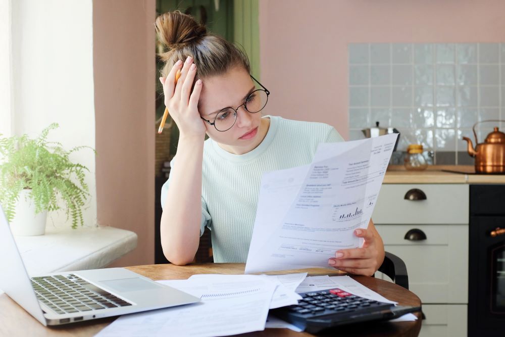 Indoor shot of young girl looking at finances