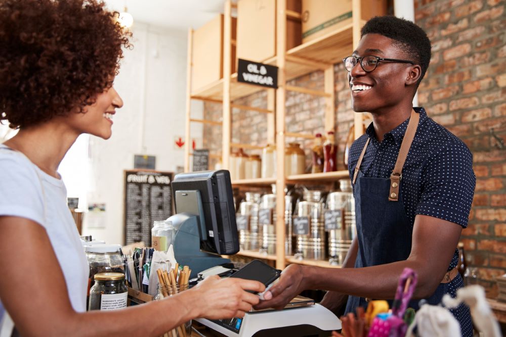 Customer Making Contactless Payment For Shopping At Checkout Of Grocery Store Using Mobile Phone