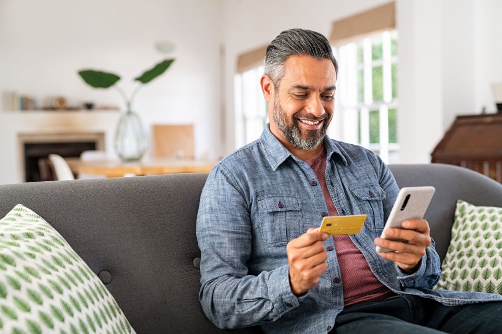 A man paying online on mobile phone