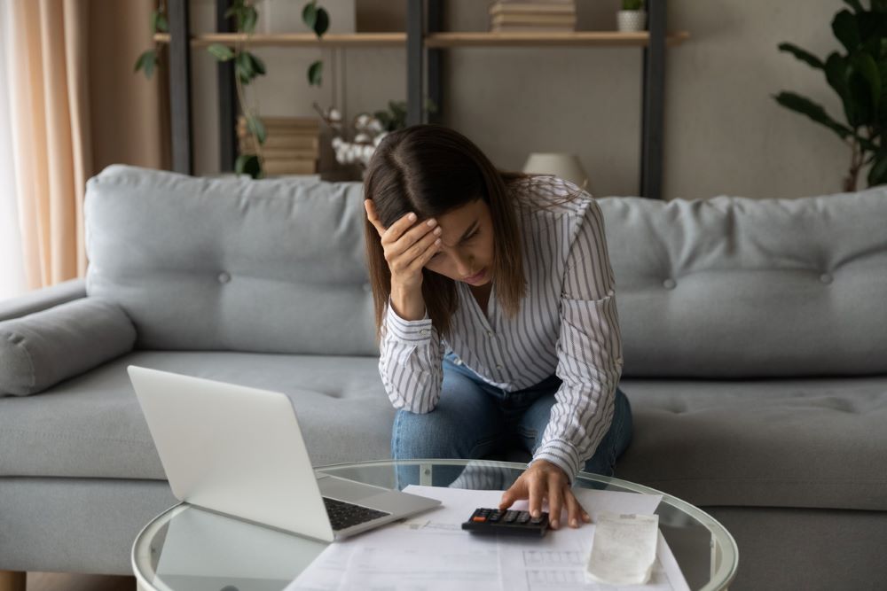 Desperate woman feeling stressed about financial problems.