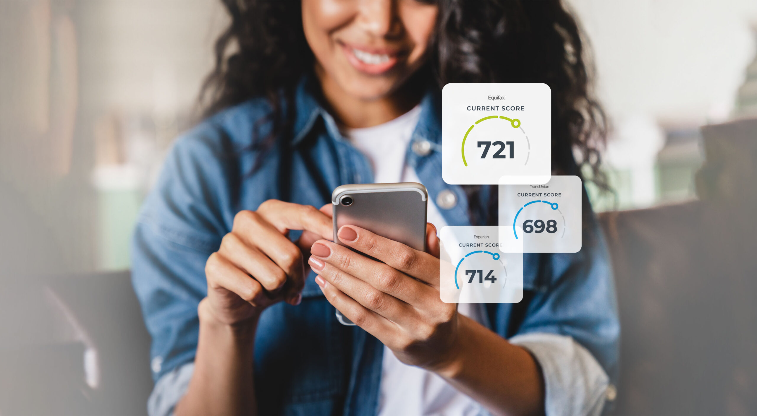 A woman is looking at her credit scores on her smartphone.