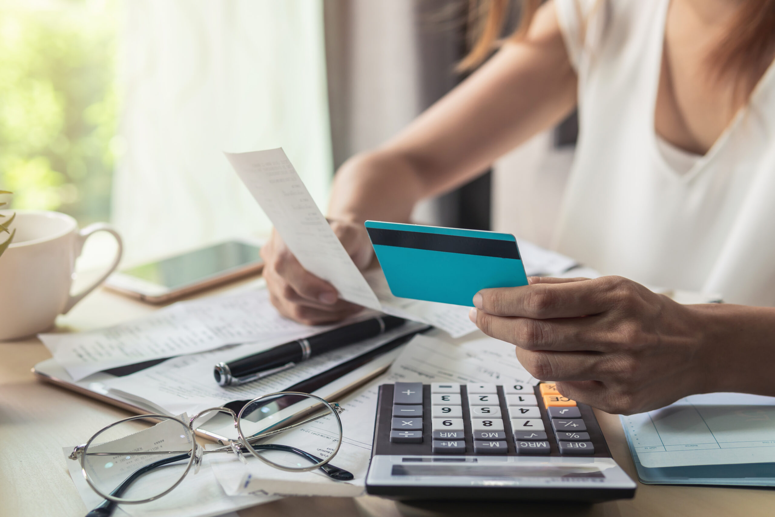 Woman looking at finance charges from credit card.