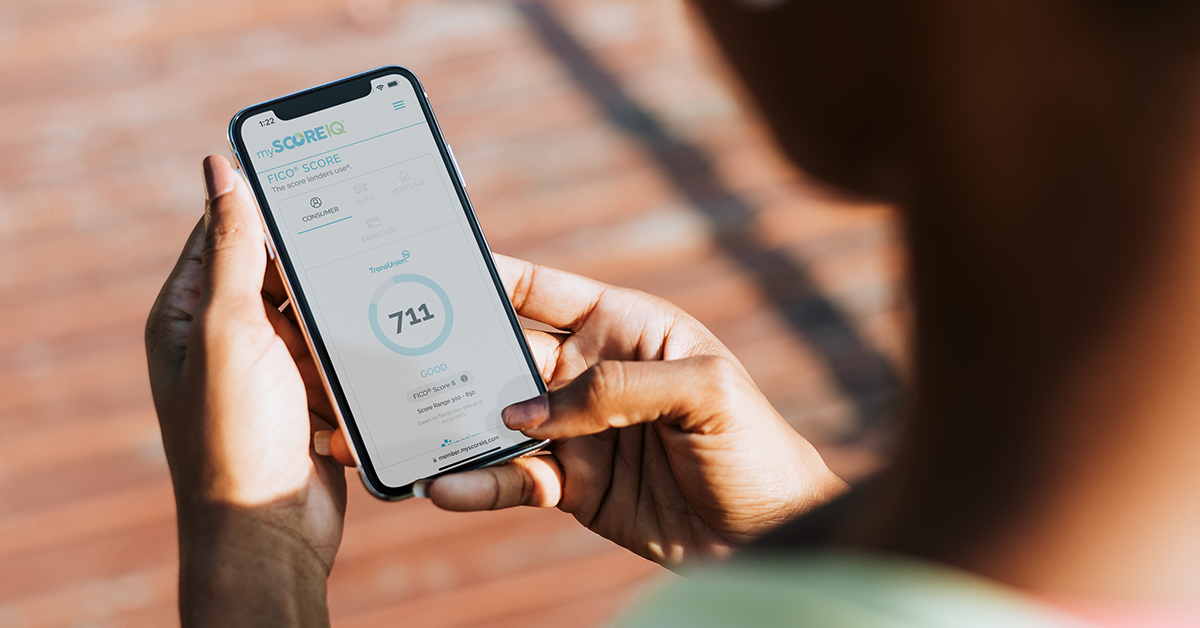 person checking their FICO® Score on phone